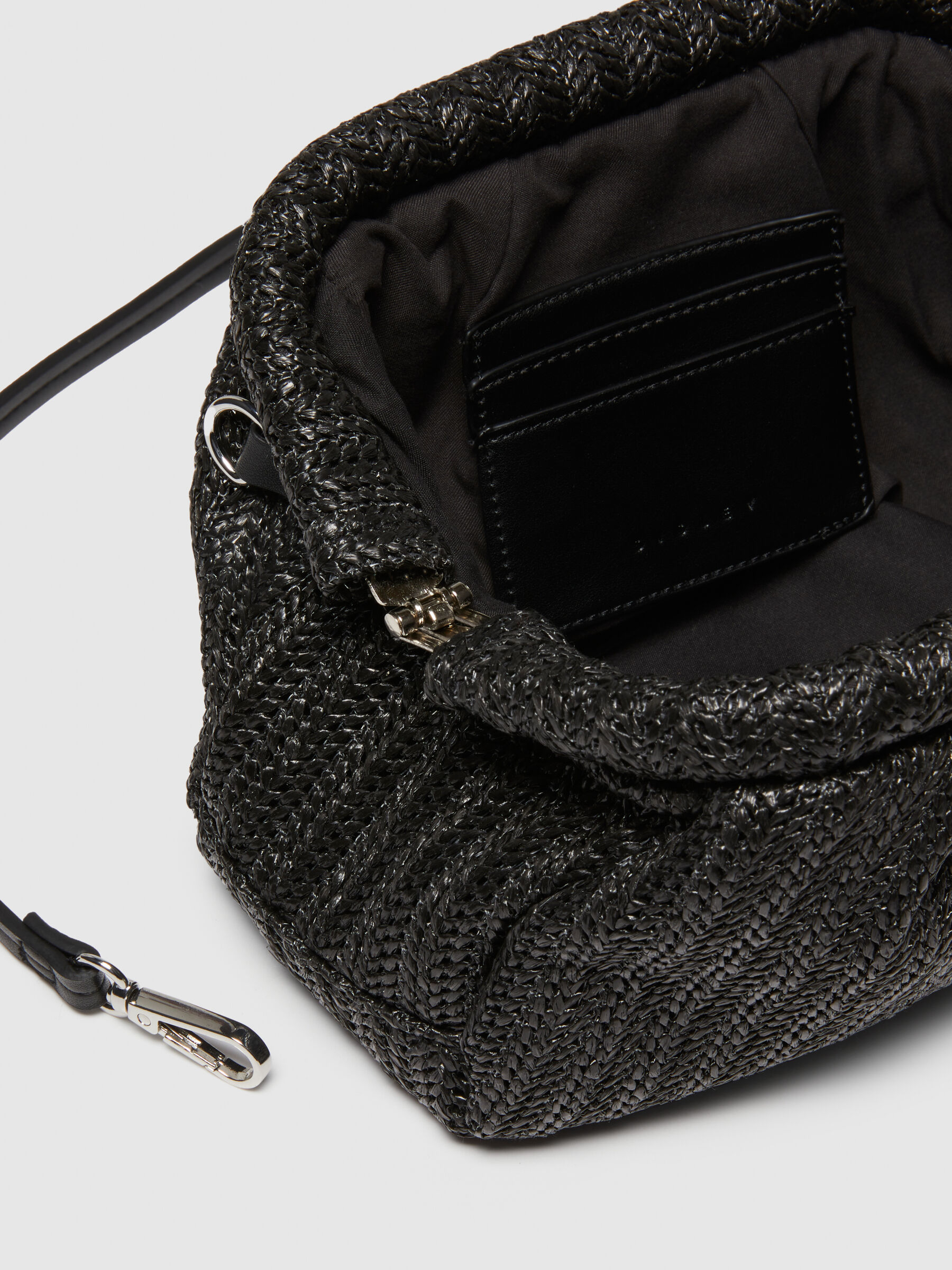 Black straw clutch 2025