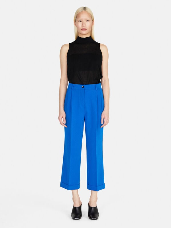 Cropped trousers with cuffs Women