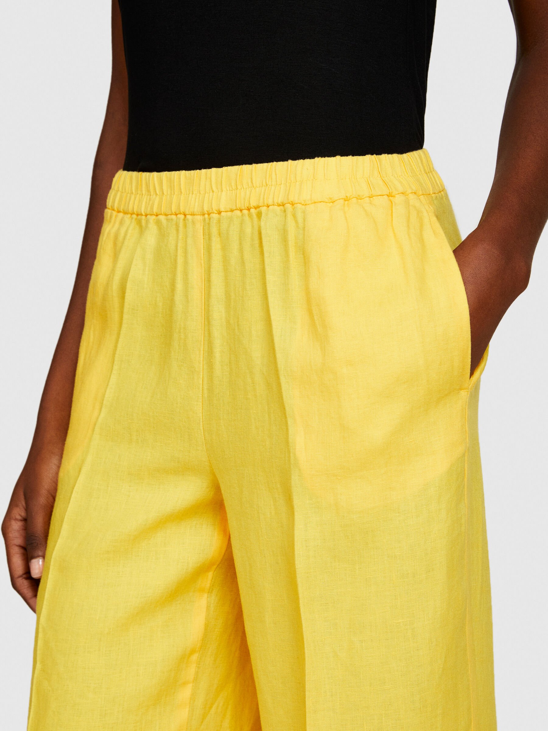 Yellow linen trousers on sale
