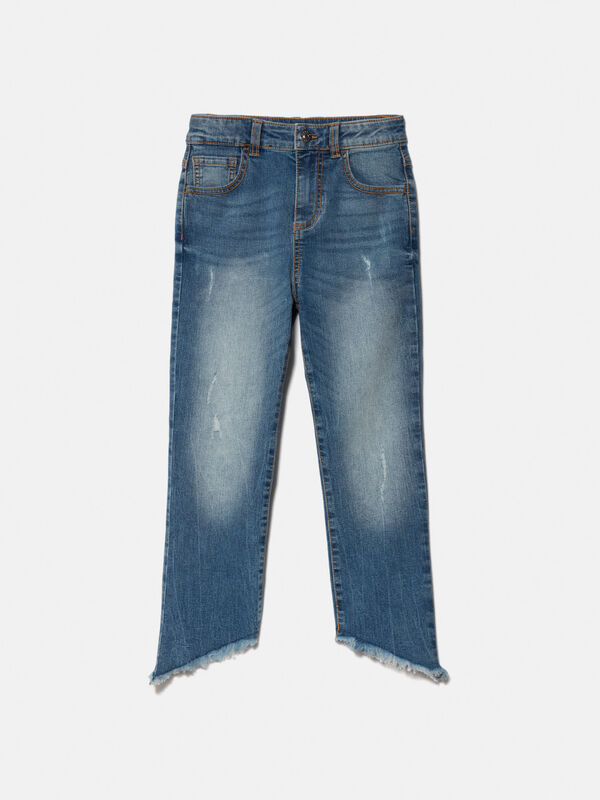 High-waisted jeans with rips