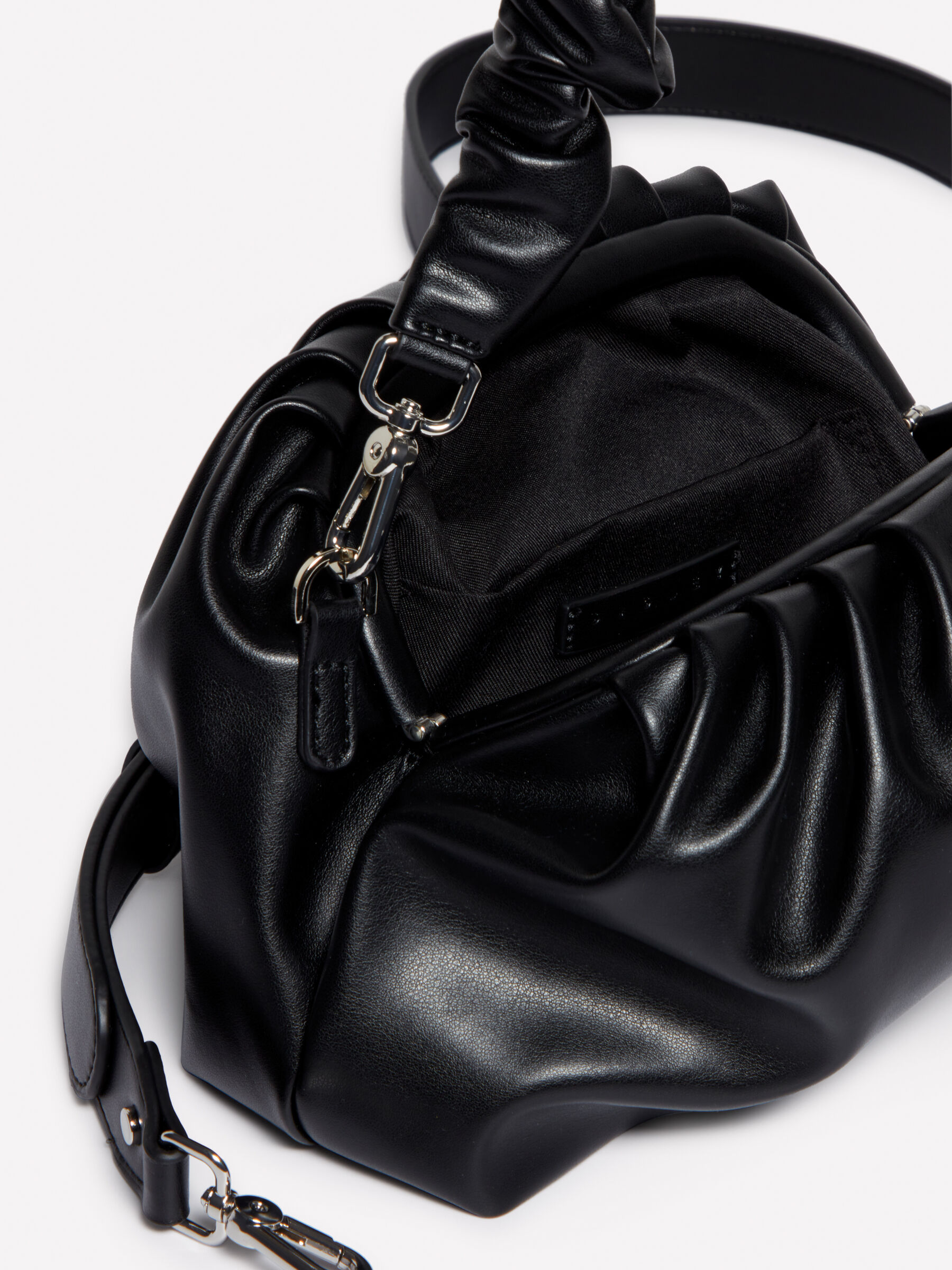 Black clutch bag with handle outlet